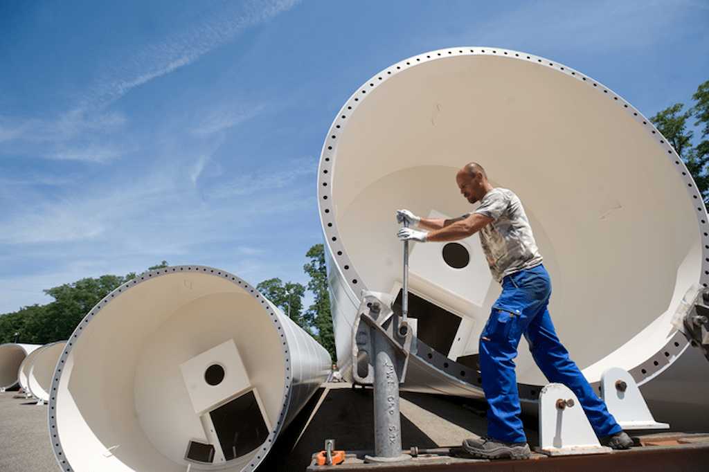 Workers storing a wind power tower